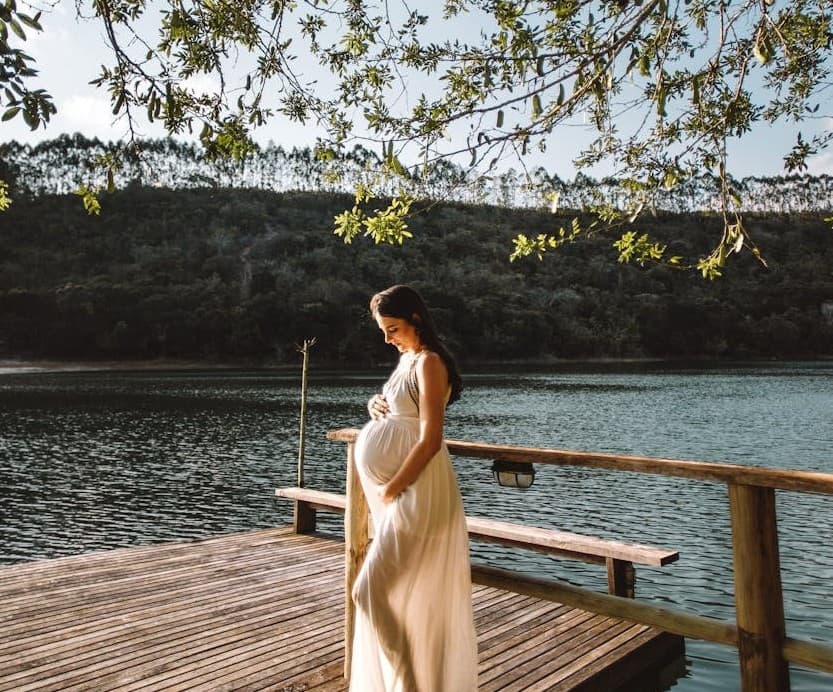 Pregnant woman by the lake
